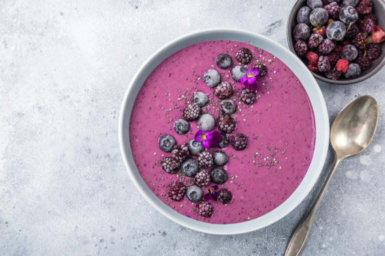 delicious blueberry smoothie bowl with frozen berries