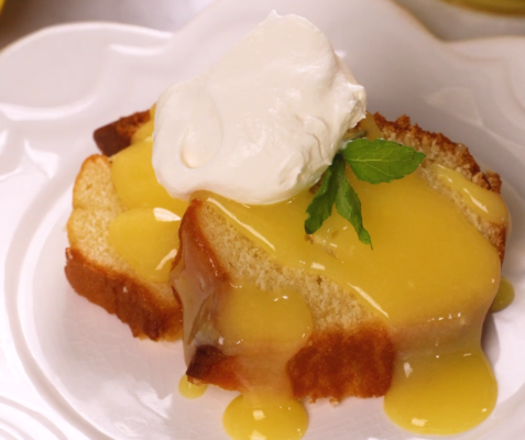 pound cake topped with lemon curd, mint, and whipped cream