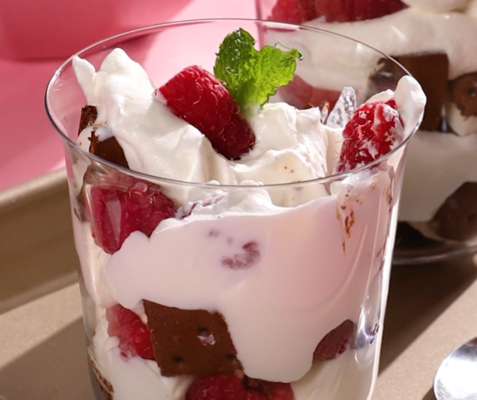 a cup filled with raspberry ice cream sandwich parfait