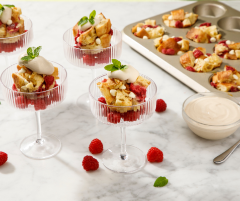 martini glasses filled with white chocolate raspberry bread pudding